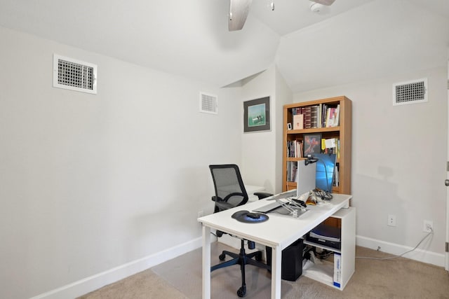 carpeted home office with ceiling fan and lofted ceiling