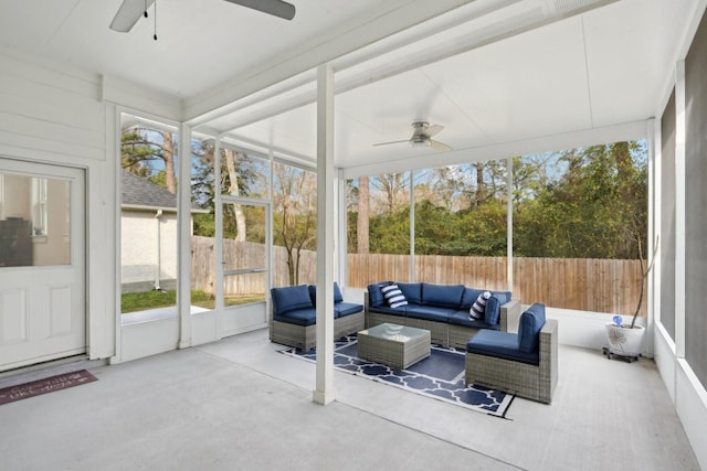 sunroom with ceiling fan