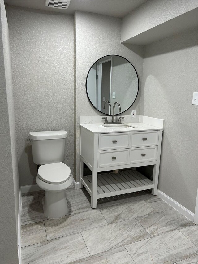 231 Dehart St Unit Cr653, Liverpool, TX 77577 - bathroom featuring vanity and a textured wall
