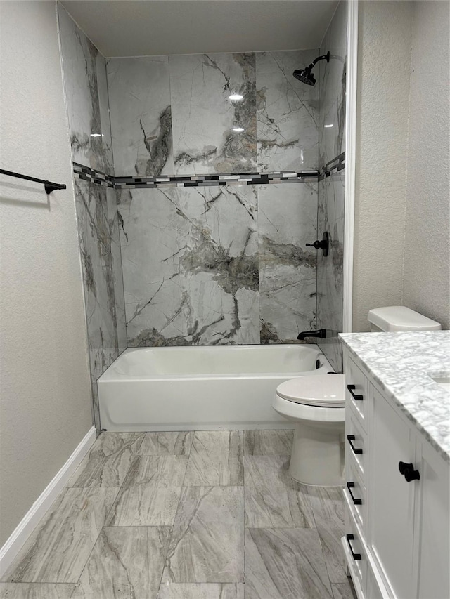 full bathroom featuring vanity, tiled shower / bath combo, and toilet