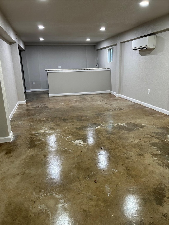 231 Dehart St Unit Cr653, Liverpool, TX 77577 - finished below grade area featuring a wall mounted air conditioner, recessed lighting, and baseboards