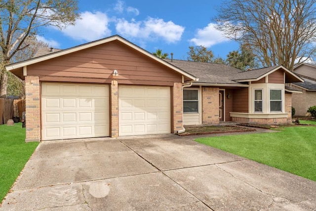 ranch-style home with a garage and a front lawn