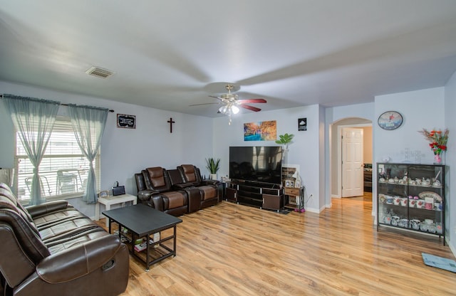 living room featuring ceiling fan and light wood-type flooring
