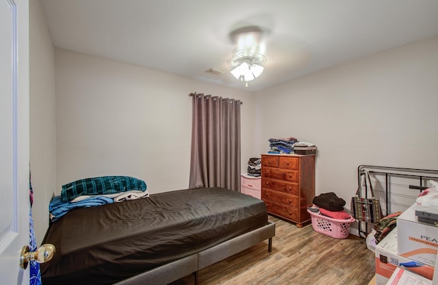 bedroom featuring hardwood / wood-style flooring