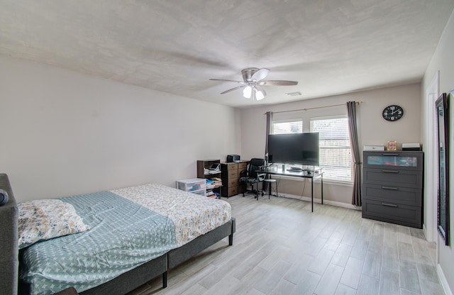 bedroom featuring ceiling fan and light wood-type flooring