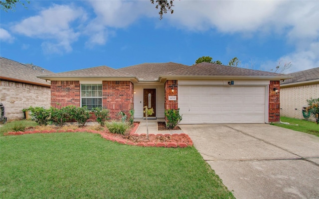 ranch-style home with a garage and a front yard