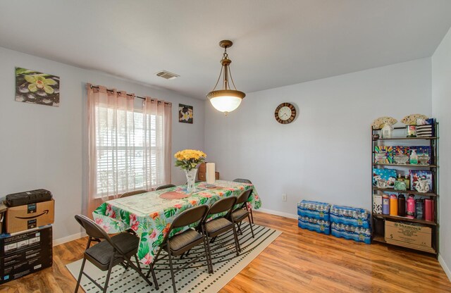 dining space featuring hardwood / wood-style floors
