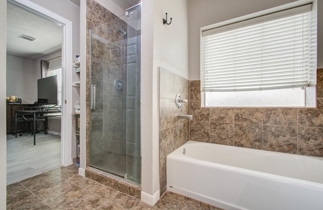 bathroom with plus walk in shower and plenty of natural light