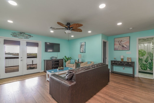 living room with french doors, ceiling fan, and hardwood / wood-style flooring