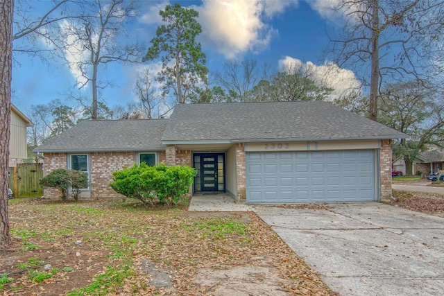 single story home featuring a garage