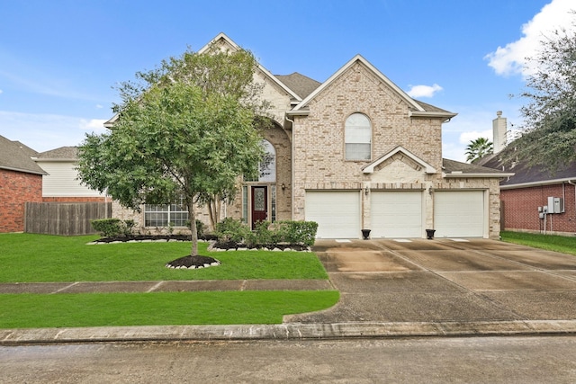 view of front facade featuring a garage and a front lawn