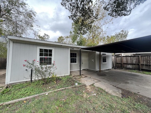 exterior space featuring a carport