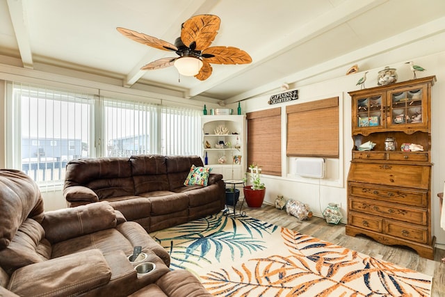 living room with ceiling fan, lofted ceiling with beams, and light hardwood / wood-style flooring