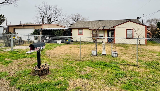 exterior space with a garage and a front lawn