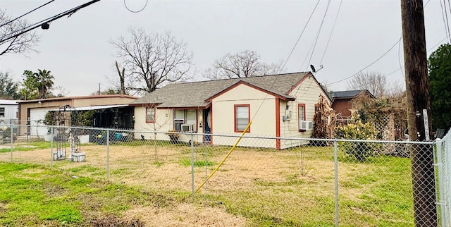 view of front of house featuring a front yard and cooling unit