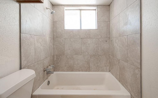 full bathroom featuring bathing tub / shower combination and toilet