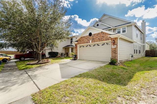 view of front of property with a garage and a front lawn