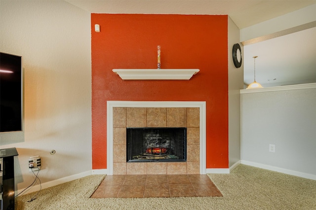 unfurnished living room with a fireplace and carpet