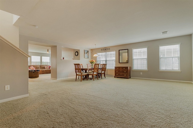 dining room with light carpet