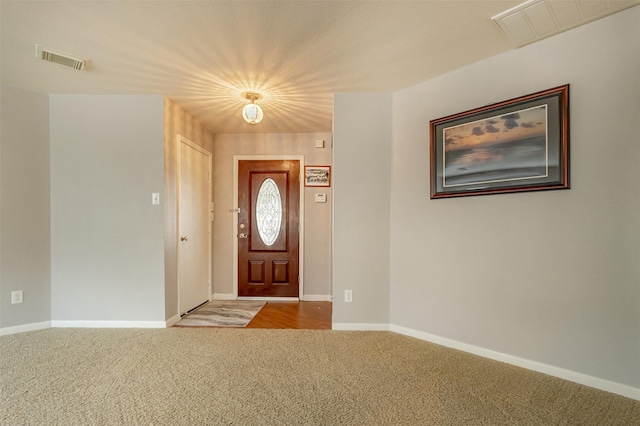 view of carpeted entrance foyer