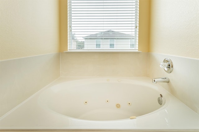 bathroom featuring a washtub