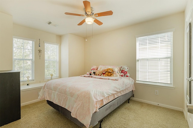 carpeted bedroom with ceiling fan