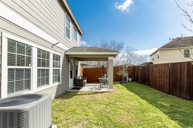 view of yard featuring a patio and central AC