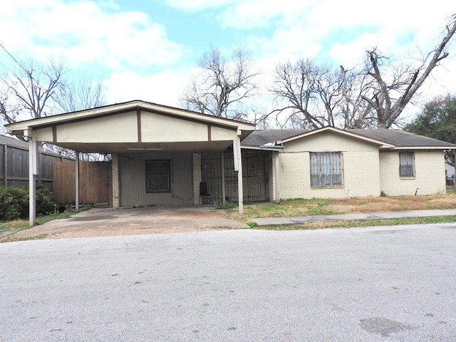 ranch-style home with a carport