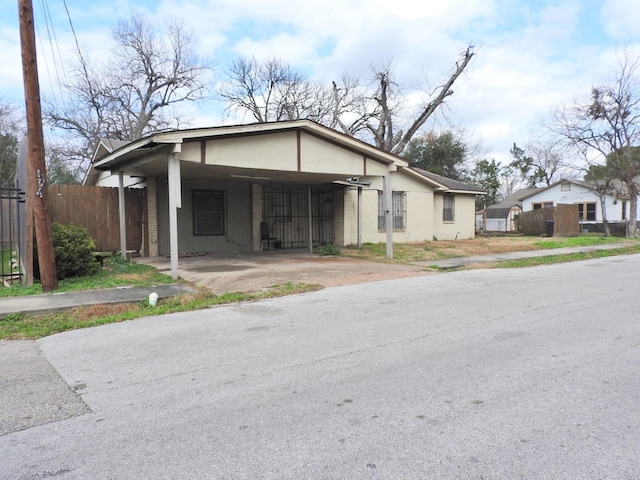 view of front of home with a carport