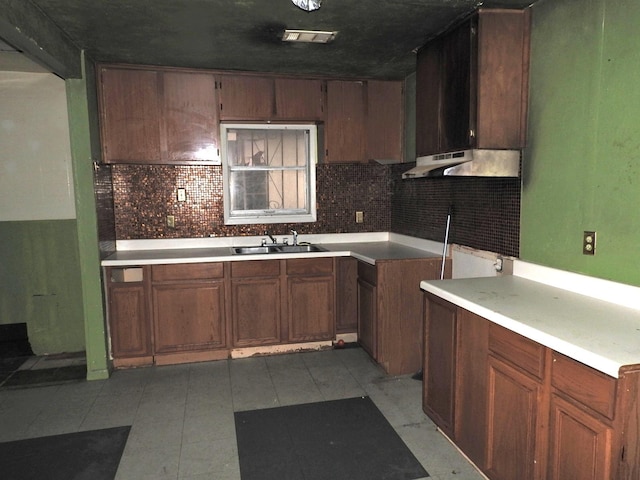 kitchen featuring sink and backsplash