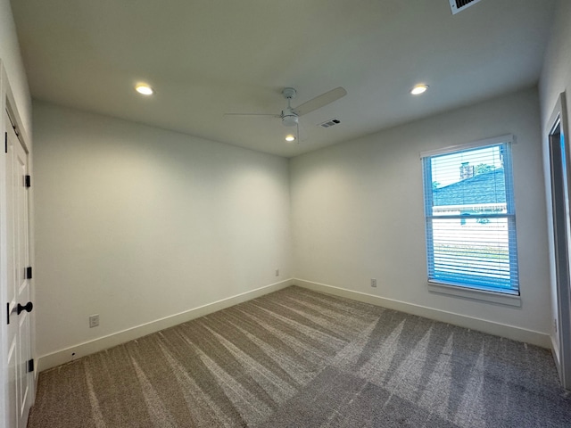 carpeted empty room with ceiling fan