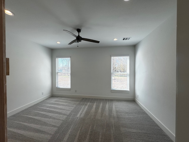 carpeted empty room with ceiling fan