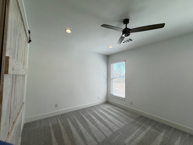 unfurnished room featuring carpet floors and ceiling fan