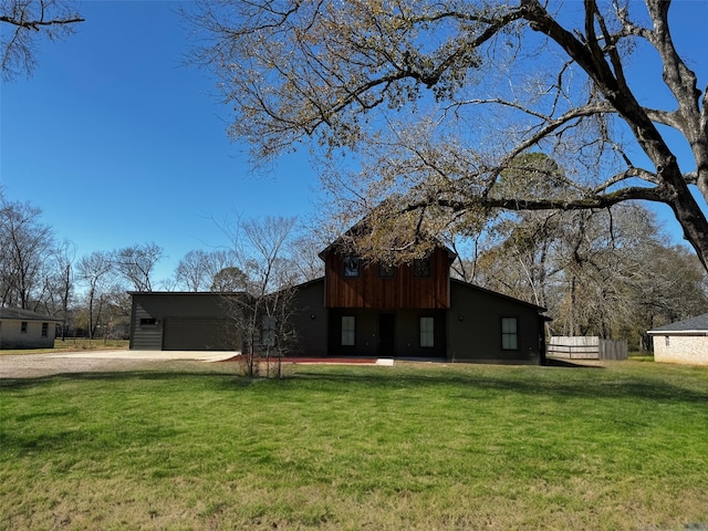 view of property exterior with a lawn and a carport