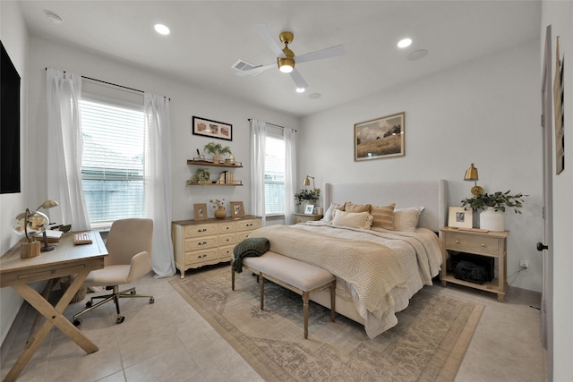 tiled bedroom featuring ceiling fan