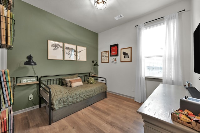 bedroom featuring light hardwood / wood-style flooring