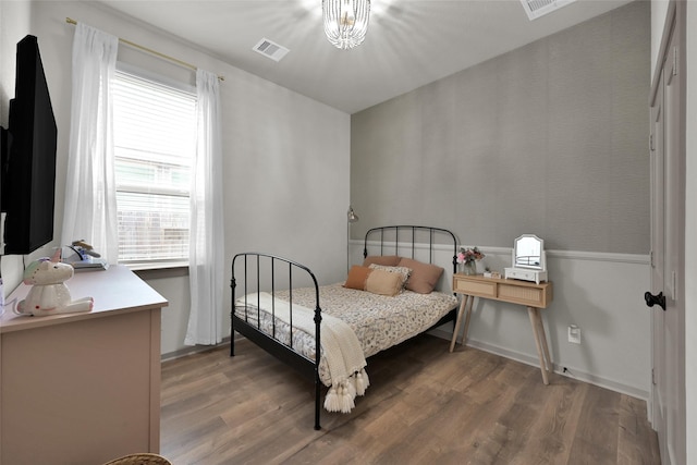 bedroom with hardwood / wood-style floors