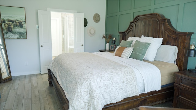 bedroom with hardwood / wood-style floors