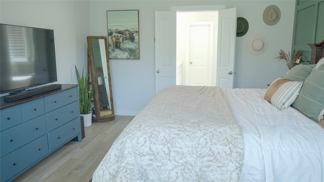 bedroom with light hardwood / wood-style flooring