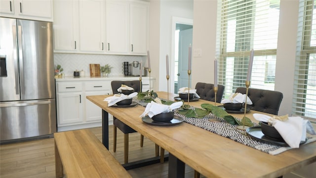 dining space featuring hardwood / wood-style floors