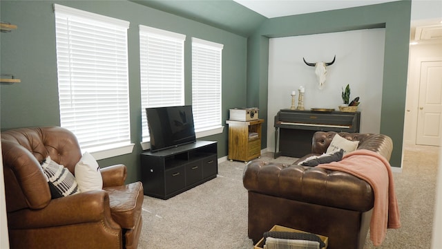 living room with light colored carpet and lofted ceiling