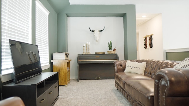 sitting room featuring light colored carpet