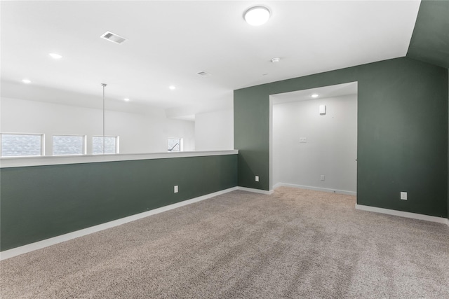 empty room featuring recessed lighting, baseboards, visible vents, and carpet floors