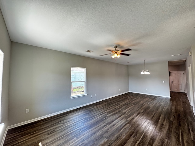 unfurnished room featuring dark hardwood / wood-style floors, ceiling fan with notable chandelier, and a textured ceiling