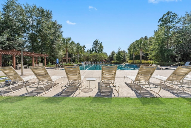 community pool with a yard, a pergola, and a patio