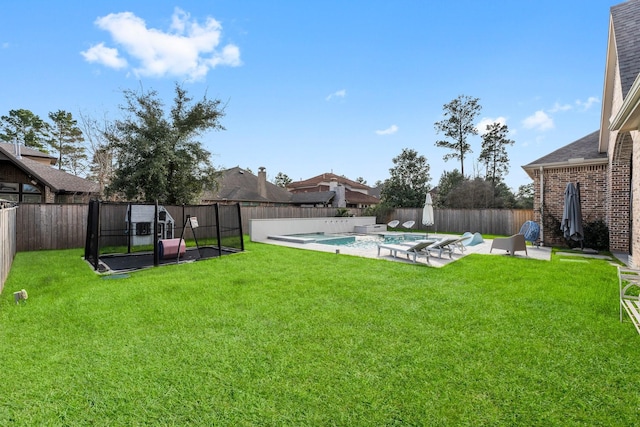 view of yard featuring a fenced backyard, a fenced in pool, and a patio