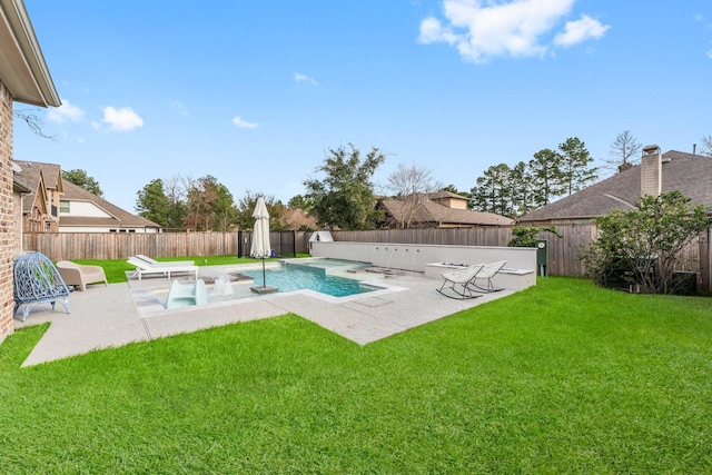 view of pool with a lawn, a patio area, and a fenced backyard