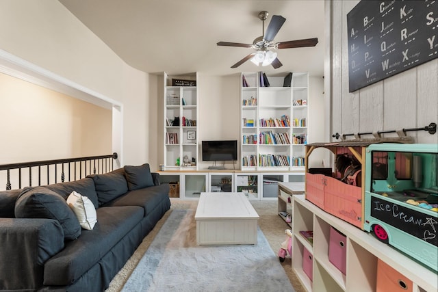 interior space featuring a ceiling fan and carpet flooring