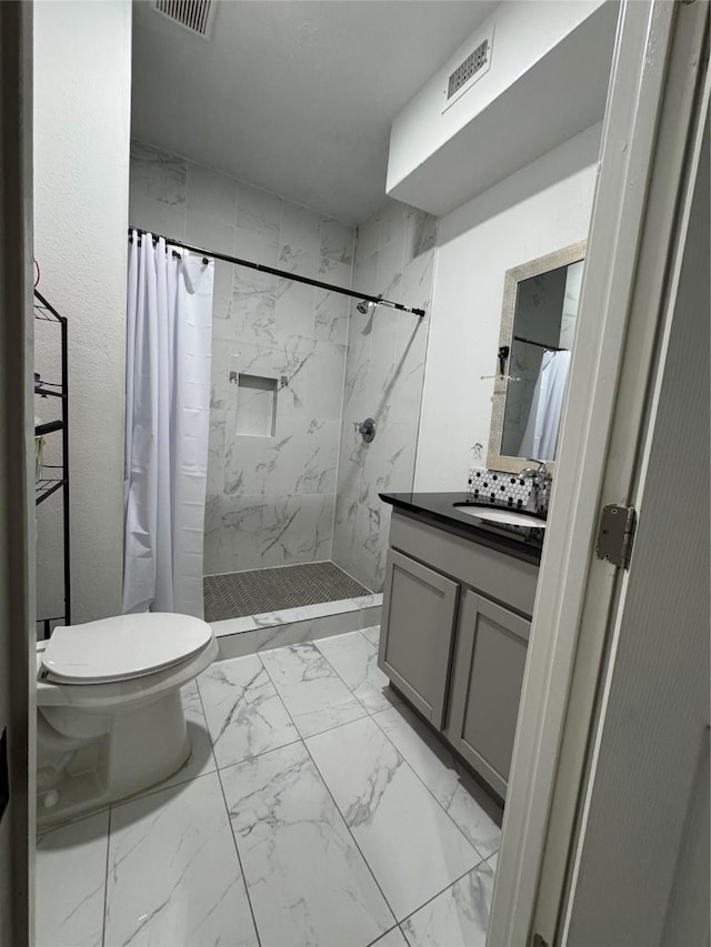 820 S Railroad Ave, Shepherd, TX 77371 - bathroom with toilet, vanity, a shower stall, marble finish floor, and visible vents