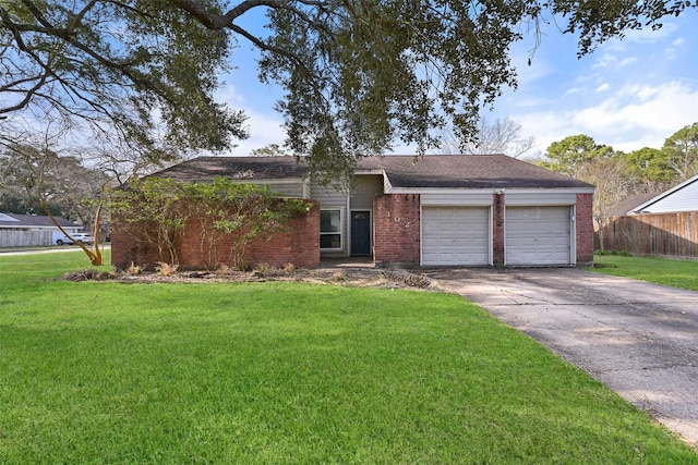 ranch-style house featuring a garage and a front yard